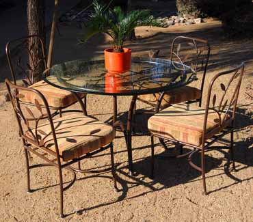 Leaf pattern table and chair set with glass top